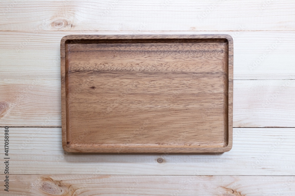 Empty wooden tray, cutting board.Table background. Top view.