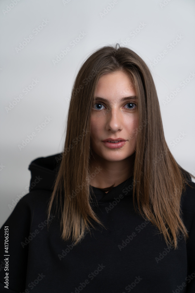 Fototapeta premium portrait of a beautiful girl on a white background close up