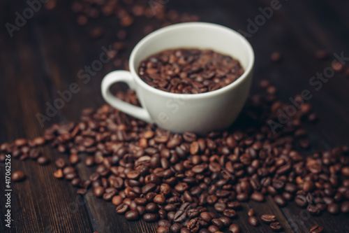 white cup with coffee beans aromatic drink morning energy