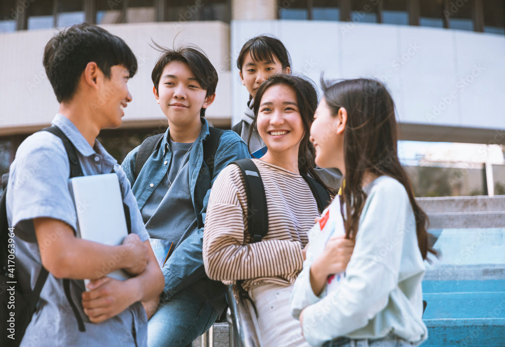 Happy Teenager Students talking and Walking On Stairs Happy Teenager Students talking and Walking On Stairs