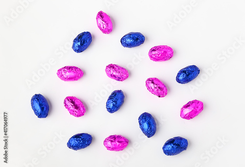 Sweet chocolate eggs on white background