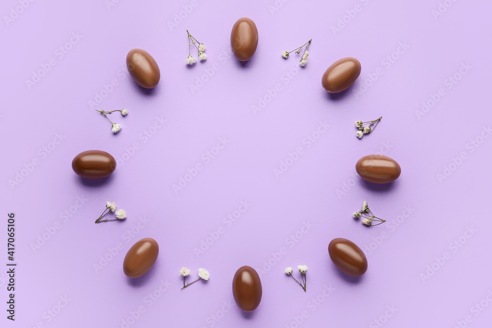 Composition with chocolate Easter eggs on color background Composition with chocolate Easter eggs on color background