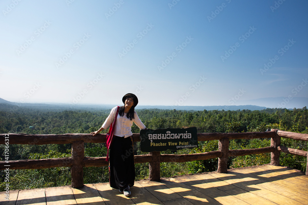 Travelers thai women people travel visit and take photo at viewpoint jungle wild forest Pha Chor canyon cliffs in Mae Wang National Park at Doi Lo city on November 10, 2020 in Chiang Mai, Thailand