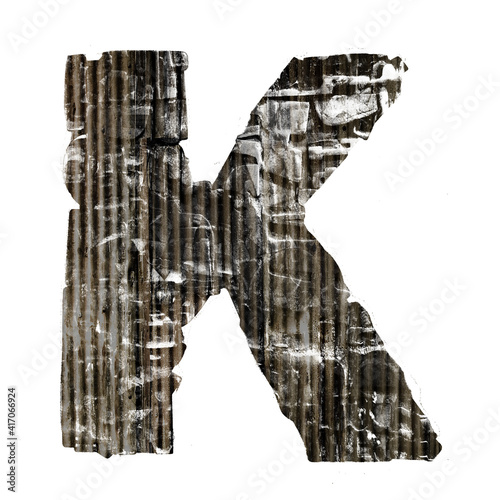 corticated iron letter K  isolated  photo