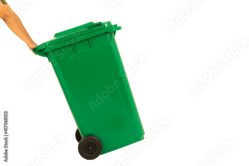 Human's hands holding and pugh a new unbox green large bins ready to use isolated on white background photo