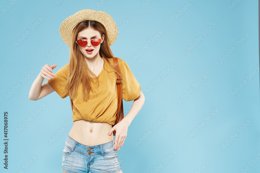 Cheerful pretty woman in hat and sunglasses hair backpack emotions lifestyle Cheerful pretty woman in hat and sunglasses hair backpack emotions lifestyle