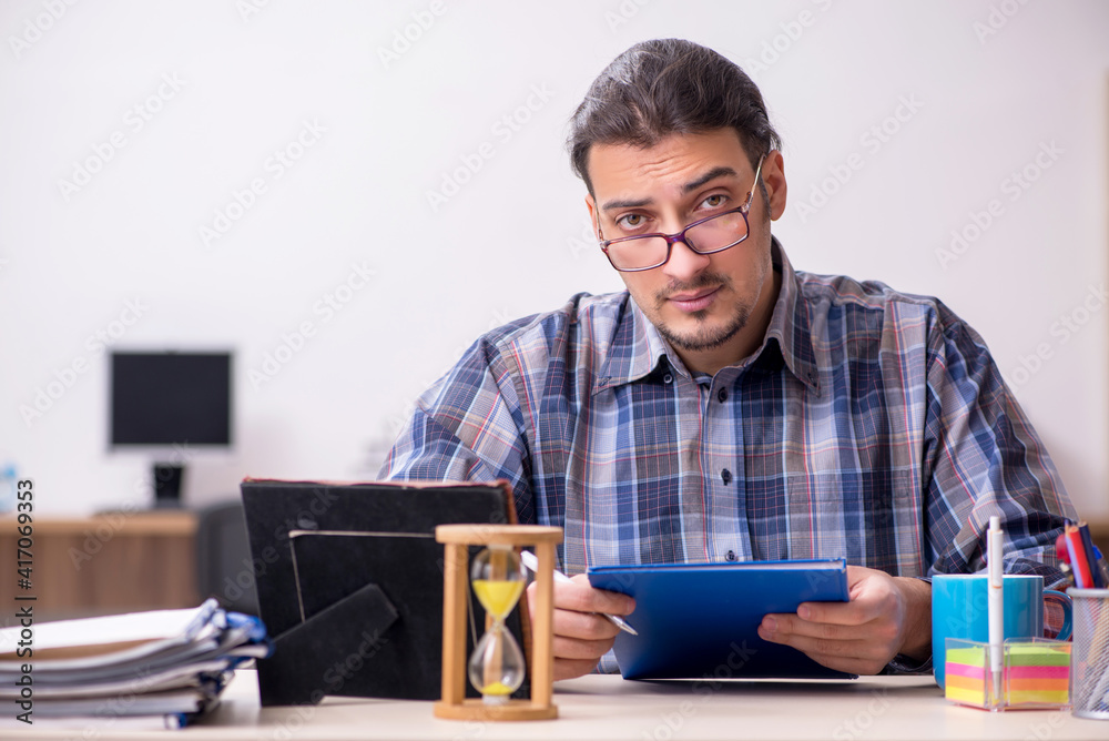 Young male student sitting in the classroom Young male student sitting in the classroom