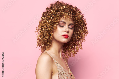 Beautiful woman Dress with sequins party disco makeup curly hair isolated background