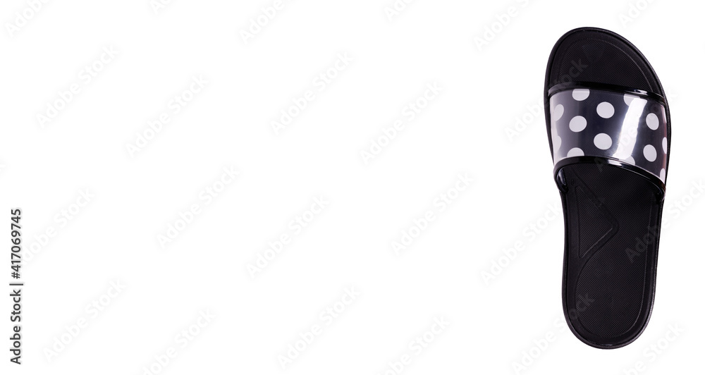 Black slippers with dotted pattern, isolated on white background. Black slippers with dotted pattern, isolated on white background.