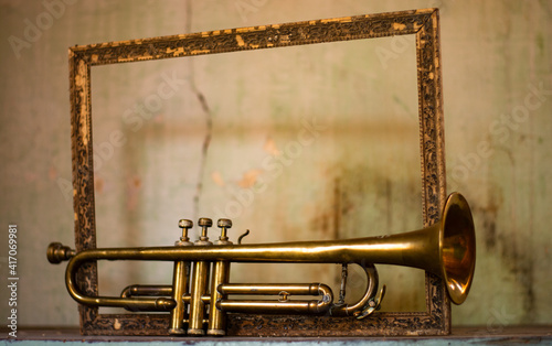 Canvas Print an ancient jazz trumpet and a frame