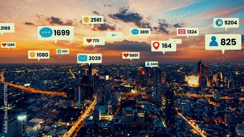Photography Social media icons fly over city downtown showing people engagement connection through social network application platform