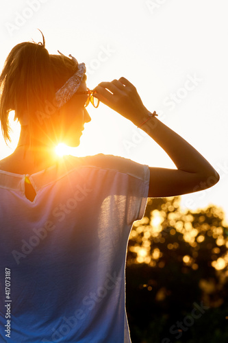 Silhouette of a woman in sunset sunrise time.