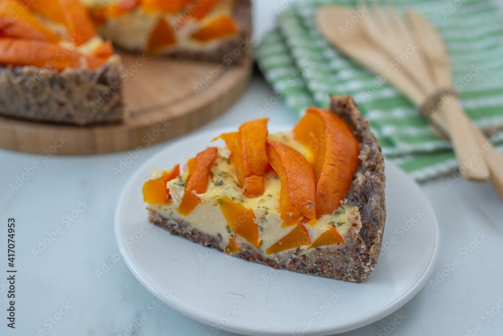 home made pumpkin quiche lorraine on a table home made pumpkin quiche lorraine on a table