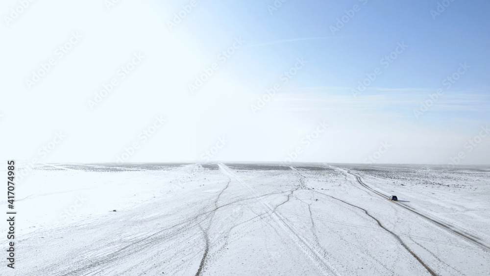 old road in the winter steppe old road in the winter steppe