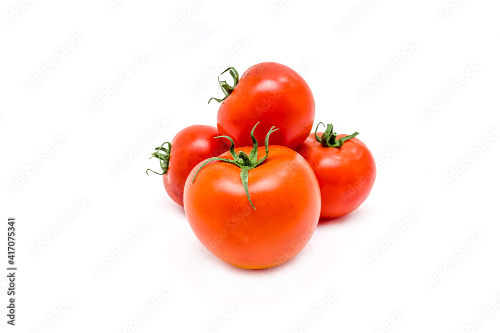 Red ripe tomatoes on a white background. Red ripe tomatoes on a white background.