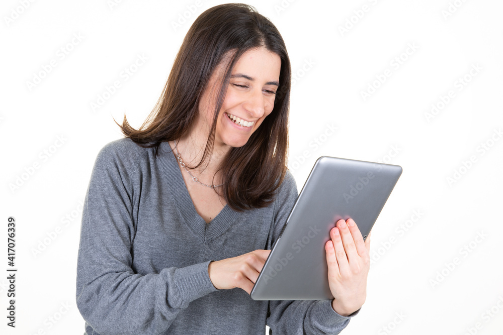 young business woman holding using tablet pc computer posing isolated on white wall background studio portrait young business woman holding using tablet pc computer posing isolated on white wall background studio portrait