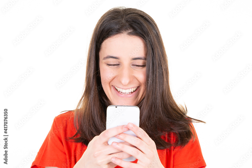Portrait of smiling young woman brown hair texting on smartphone with smile happiness on phone Portrait of smiling young woman brown hair texting on smartphone with smile happiness on phone