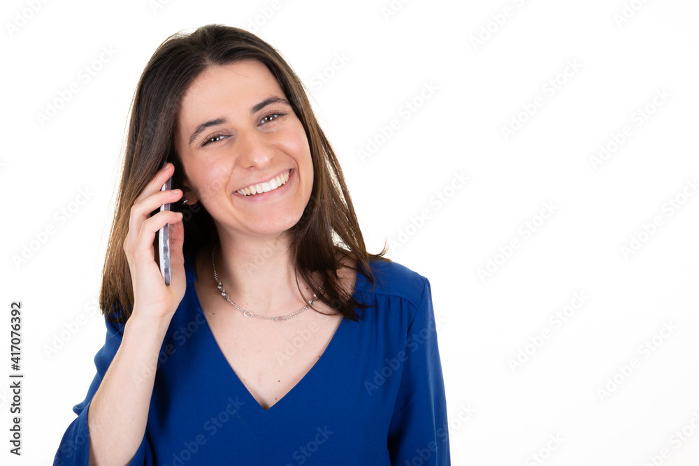 Portrait of smiling young pretty woman talk on smartphone cell phone isolated on white background Portrait of smiling young pretty woman talk on smartphone cell phone isolated on white background
