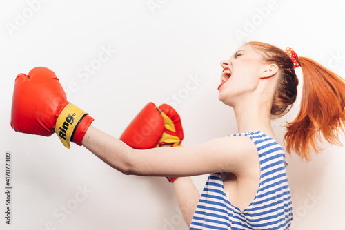 aggressive woman doing sports boxing striped t-shirt hairstyle model