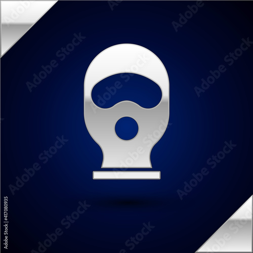Silver Balaclava icon isolated on dark blue background. A piece of clothing for winter sports or a mask for a criminal or a thief. Vector.