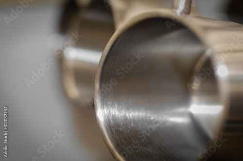 Stainless steel thermo mug with blurred background.