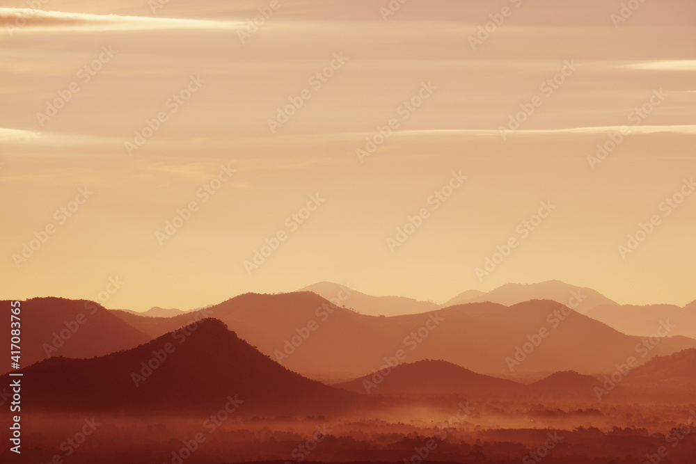 Landscape Arrange Mountains hill with mist fog  in the morning - nature scenery from  Phuthok Chaing Khan Loei Thailand , dark red nature image background and Backdrop