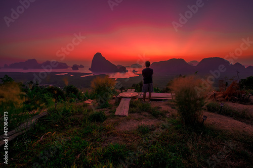 Panoramic nature background  mountains  sea  trees  twilight lights in the sky  waterfront communities   naturally blurred through the wind  seen on tourist spots or scenic spots