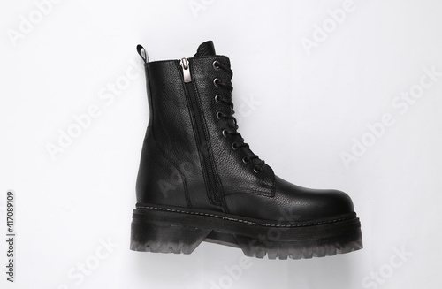 Fashionable stylish leather female boot on white background. Top view