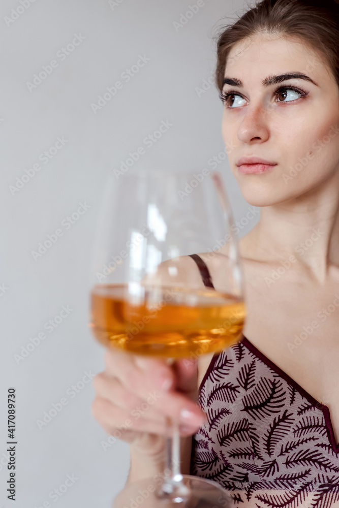 woman enjoying glass of white wine