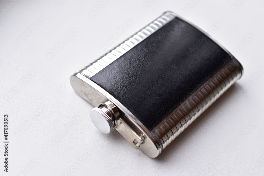 Iron flask for water or alcohol on a white background Iron flask for water or alcohol on a white background