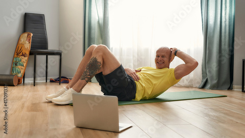 Coach performing exercises in self-isolation