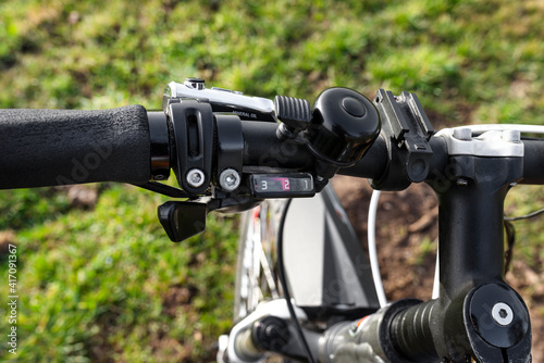 Mountain bike handlebar with hydraulic brake lever with mineral oil inside and derailleur lever.