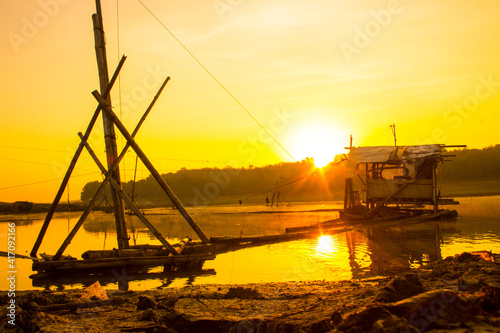 beautiful morning sunrise over keramba ikan (fish farming) in lake.
keramba ikan is traditional fish cages, traditional aquaculture farm in indonesia photo