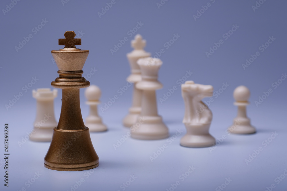 Golden pieces of chess. Business, Competition, Game or Political idea with chess