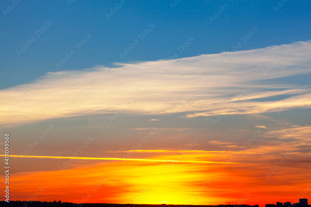 Fototapeta premium Vibrant sky during the twilight . The silhouette of the city in the evening