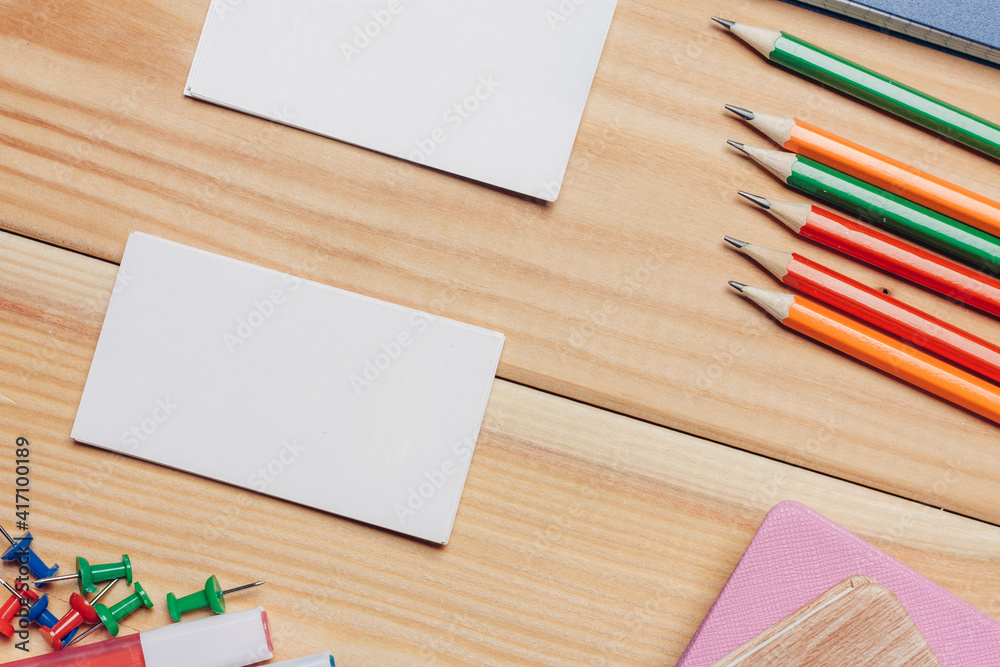 Obraz premium business cards colorful pencils work desk stationery top view