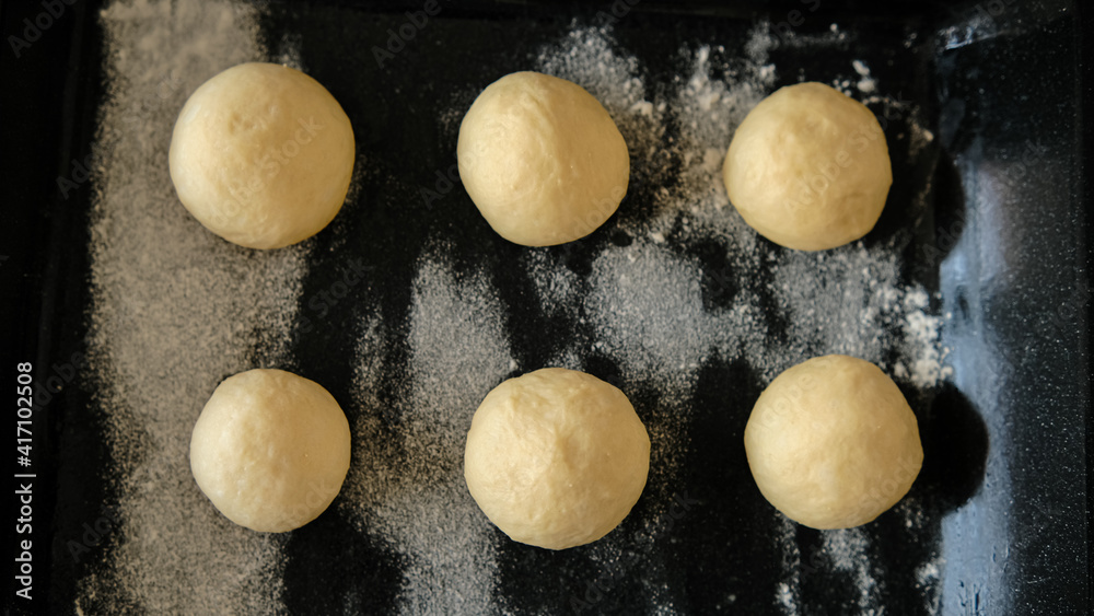 Close-up of raw dough for buns, cakes. On the wick. Flour products. Gluten free Close-up of raw dough for buns, cakes. On the wick. Flour products. Gluten free