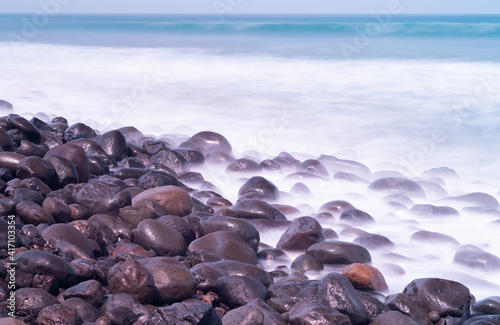 ounded rocks and waves at beach_02