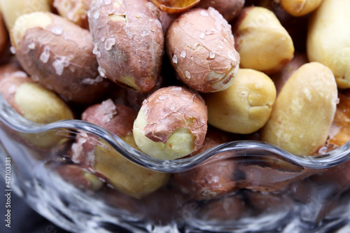 salted peanuts in a glass bowl