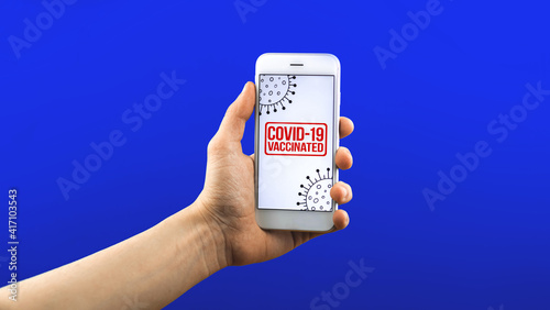 Immunity control, digital app concept on a screen of smartphone, COVID-19 vaccinated text on it, banner and copy space