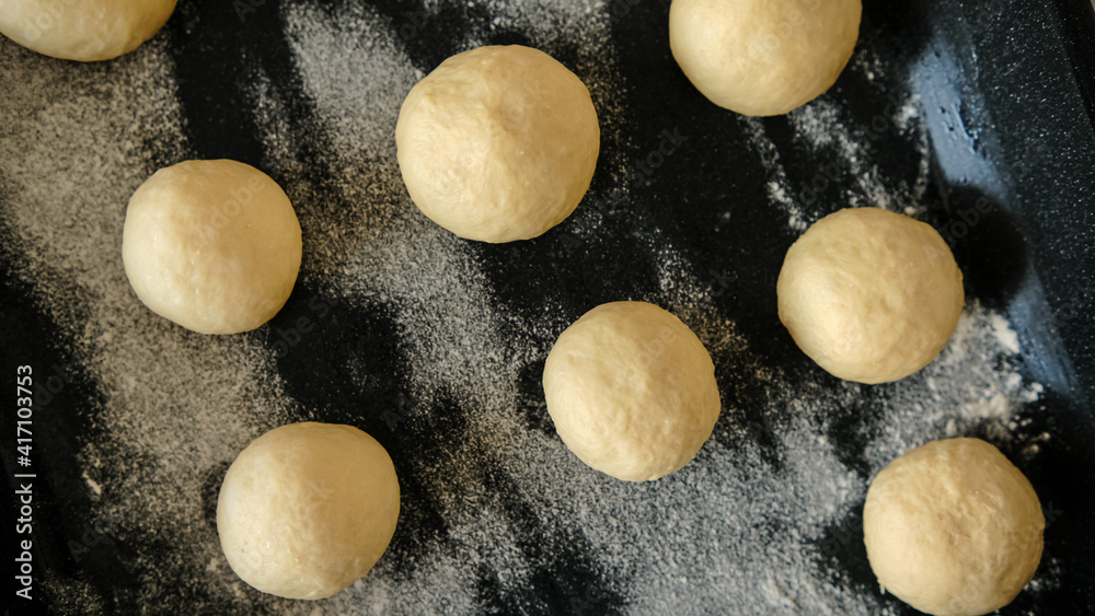 Close-up of raw dough for buns, cakes. On the wick. Flour products. Gluten free Close-up of raw dough for buns, cakes. On the wick. Flour products. Gluten free