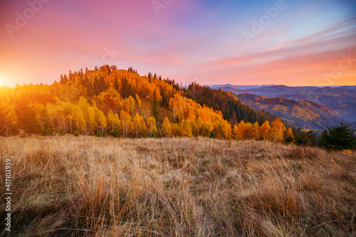 Splendid sunset in the autumn alpine highlands. Location place Carpathian mountains, Ukraine, Europe.