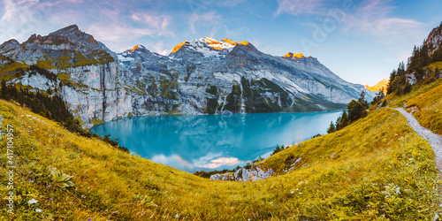 Idyllic panorama view of the lake Oeschinensee. Location place Swiss alps, Kandersteg, Europe. © Leonid Tit
