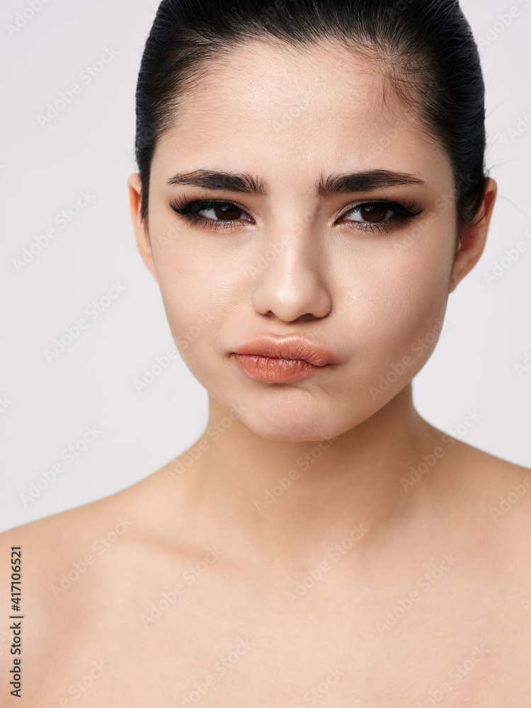pretty emotional woman with bare shoulders glamor close-up pretty emotional woman with bare shoulders glamor close-up