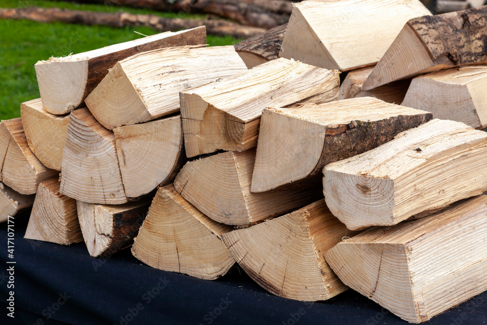 Chopped log firewood woodpile stack ready for use in the fireplace in winter, stock photo image Chopped log firewood woodpile stack ready for use in the fireplace in winter, stock photo image