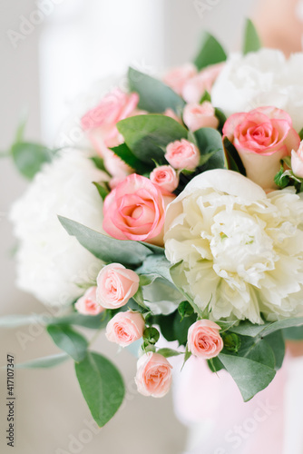 Beautiful modern wedding bouquet close-up. pink and white color scheme