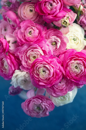 Delicate floral arrangement. Close-up floral composition with a pink Ranunculus flowers . Beautiful bouquet of a spring flowers.   