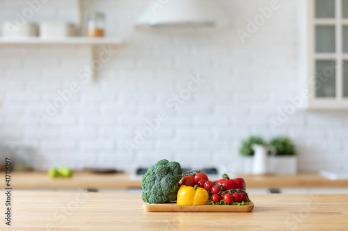 Vegetables on a cutting board in the kitchen. photo