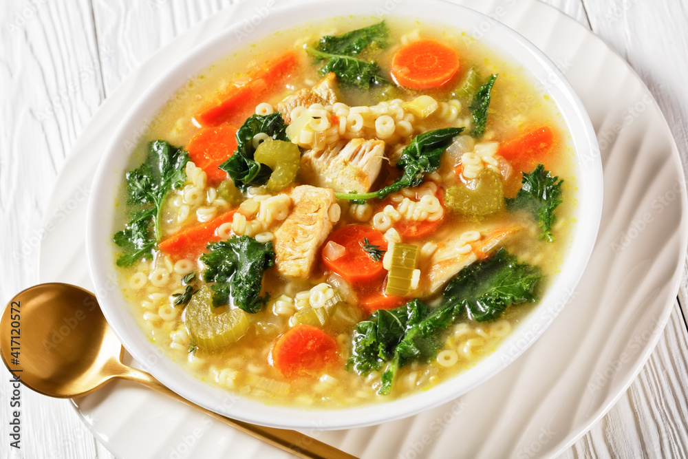 chicken kale veggies soup in a bowl chicken kale veggies soup in a bowl