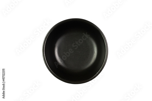 Small black bowl isolated on white background, Top view. The bowl is a kitchen utensil for holding food.
